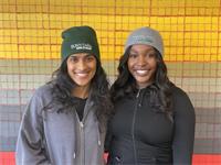 2 girls modeling green and blue-grey beanies 